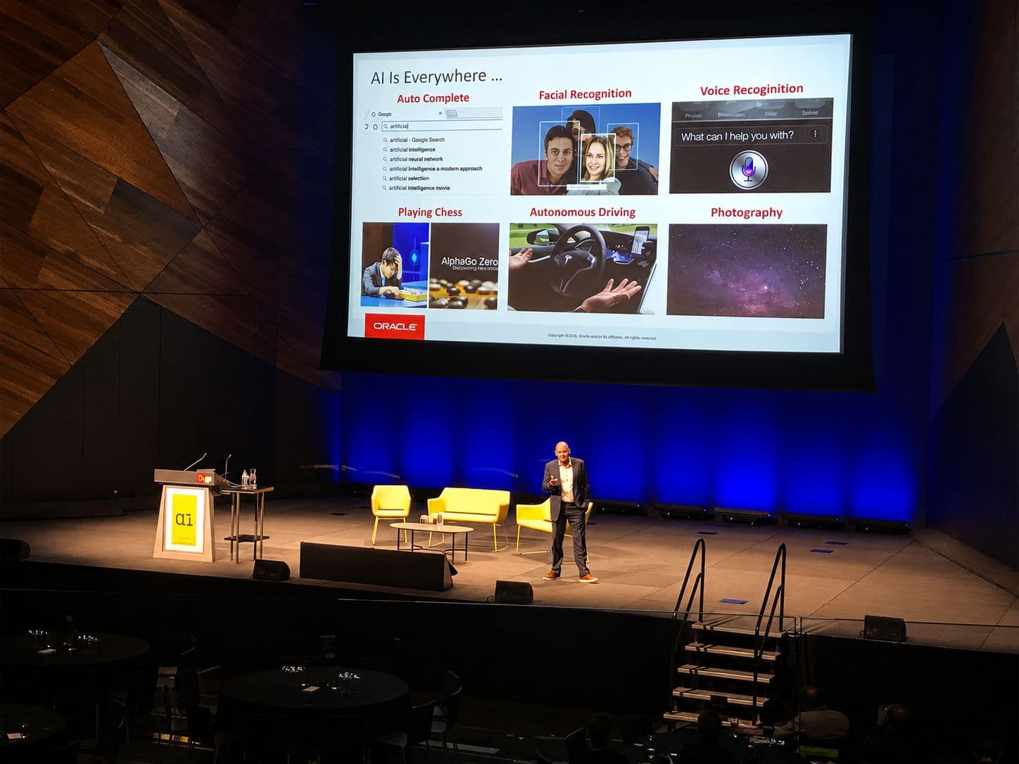 AI Summit, Melbourne, 2019: a speaker on stage beneath a slide headed "AI Is Everywhere"