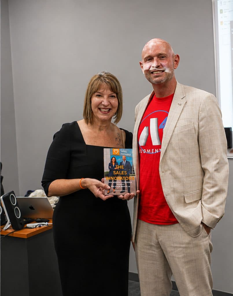 PMI Sydney Event, 2026: two people standing together with a copy of The Sales Innovators
